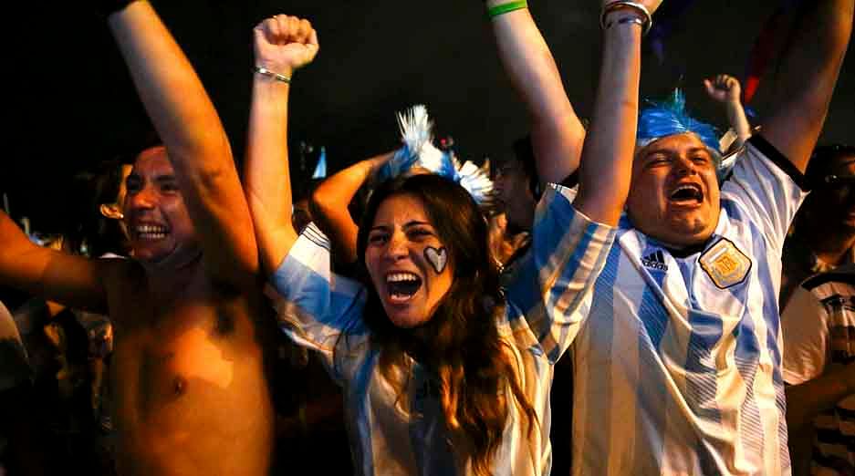Argentina fans celebrate after their team won the 2014 World Cup semi-final match against the Netherlands as they watched at Copacabana beach in Rio de Janeiro on July 9, 2014. Reuters