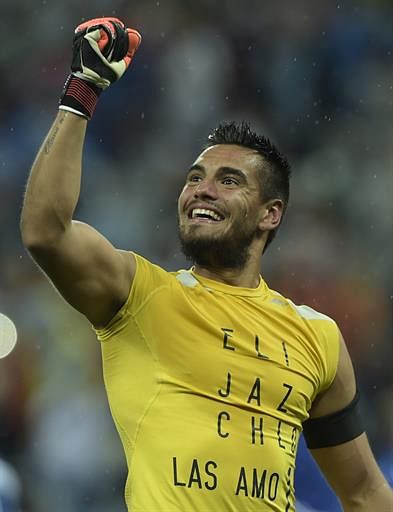 Argentina's goalkeeper Sergio Romero saves a goal during the penalty shoot-out following extra time during the semi-final football match between Netherlands and Argentina of the FIFA World Cup at The Corinthians Arena in Sao Paulo on July 9, 2014. AFP