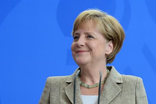German Chancellor Angela Merkel smiles during a joint press conference with Moldova's Prime Minister after talks at the chancellery in Berlin on July 10, 2014. AFP