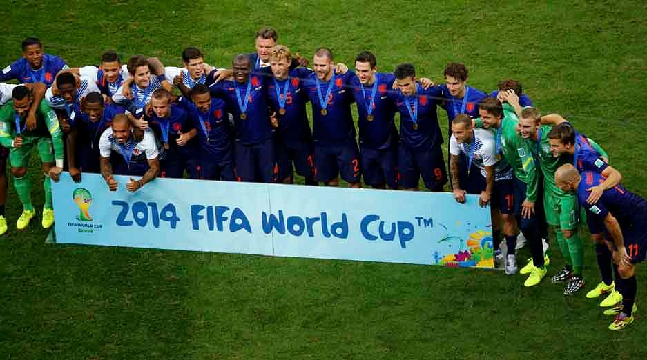 Netherlands team pose after winning the 2014 World Cup third-place playoff against Brazil at the Brasilia national stadium in Brasilia on July 12, 2014. Reuters