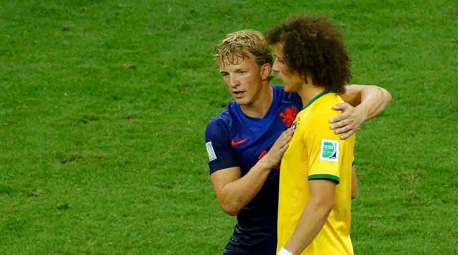 Dirk Kuyt of the Netherlands consoles Brazil
