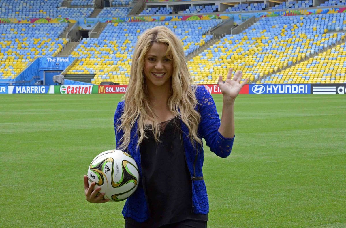 Colombia Pop singer Shakira poses with a football ball on the pitch of the Maracana stadium in Rio de Janeiro on July 12, 2014, a day before the 2014 FIFA World Cup final between Germany and Argentina. Photo: AFP