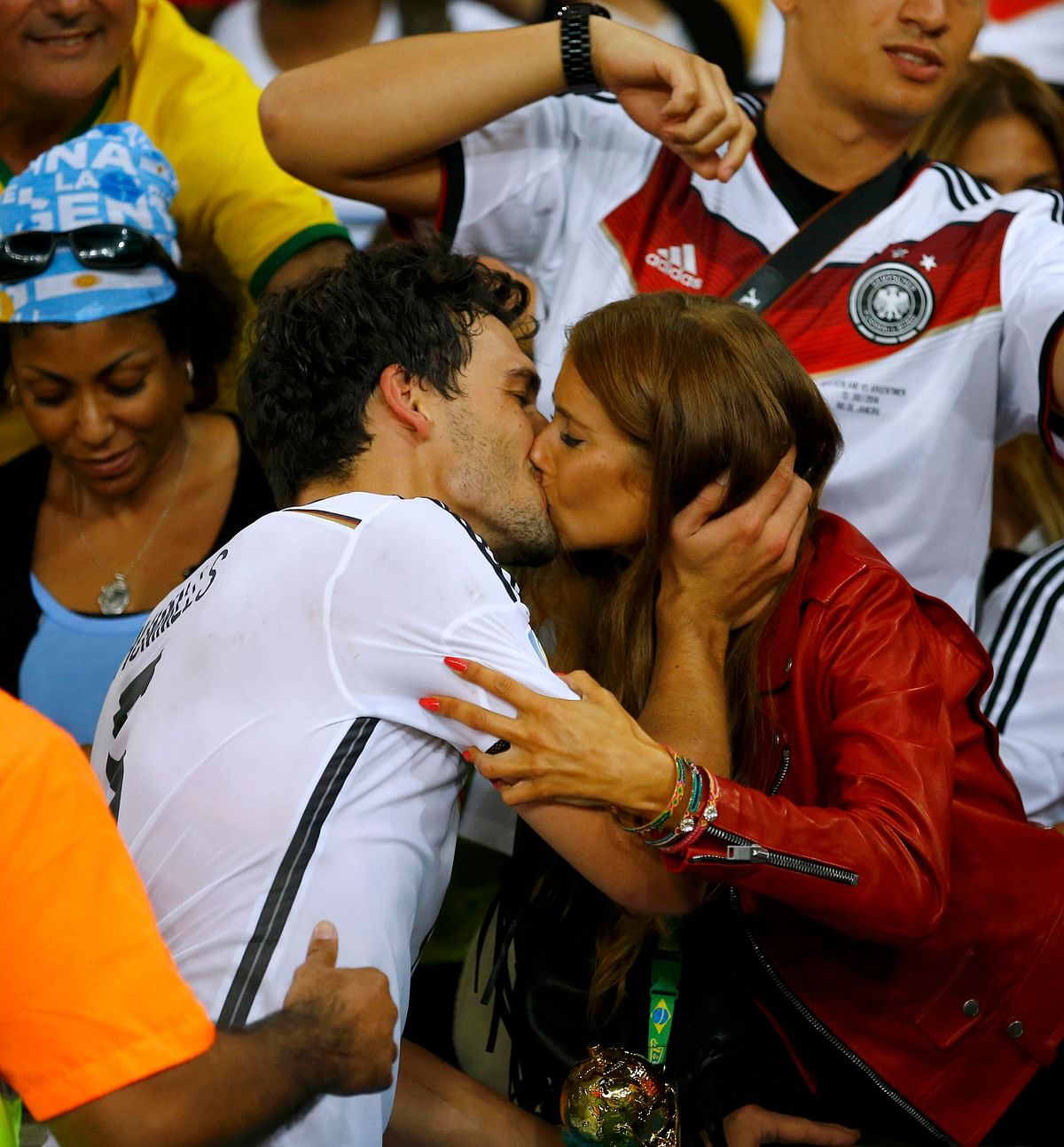 Germany's Mats Hummels kisses his girlfriend Cathy Fischer after extra time in the 2014 World Cup final between Germany and Argentina at the Maracana stadium in Rio de Janeiro on July 13, 2014. Reuters