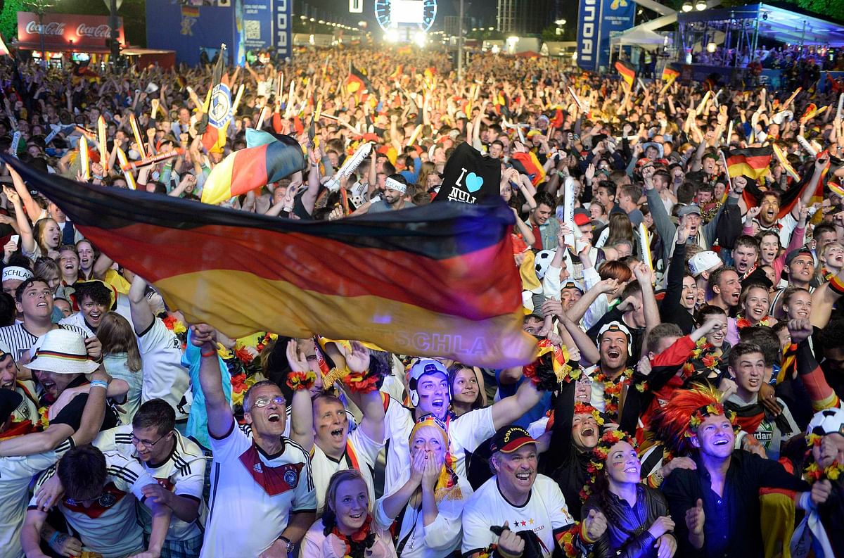 Fans of Germany celebrate as they watch the 2014 World Cup final between Germany and Argentina in Brazil at a public screening of the match in Berlin on July 13, 2014. Reuters