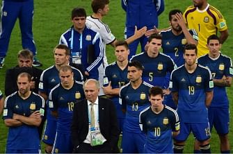 Argentina's coach Alejandro Sabella and Argentina's forward and captain Lionel Messi (R) react after losing the 2014 FIFA World Cup final football match between Germany and Argentina at the Maracana Stadium in Rio de Janeiro on July 13, 2014. AFP
