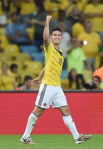 Colombia's midfielder James Rodriguez celebrates scoring the 2-0 goal during the Round of 16 football match between Colombia and Uruguay at the Maracana Stadium in Rio de Janeiro during the 2014 FIFA World Cup in Brazil on June 28, 2014. AFP