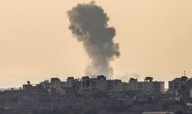 A picture taken from the Israel-Gaza border shows smoke rising from the coastal side of the Gaza strip following an Israeli military strike on August 4, 2014. AFP