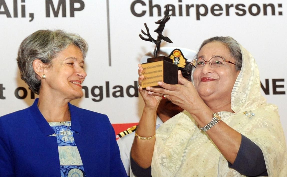 UNESCO director general Irina Bokova presents a memento titled, ‘Peace Tree’, to Prime Minister Sheikh Hasina in recognition of her outstanding contribution to girls’ and women education. Photo: Focus Bangla