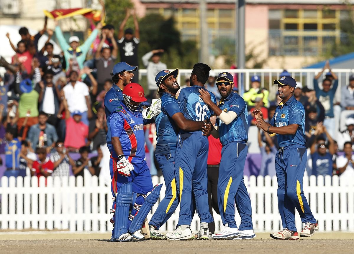 Sri Lanka's players celebrate during their men's final Twenty20 cricket match against Afghanistan at the Yeonhui cricket ground during the 17th Asian Games in Incheon on October 3, 2014. Reuters