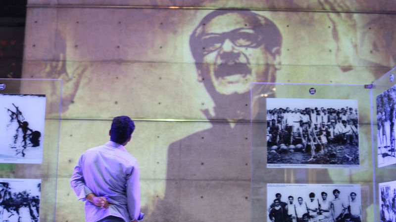 A visitor watches the video footage of 7 March speech given by Bangabandhu Sheikh Mujibur Rahman.