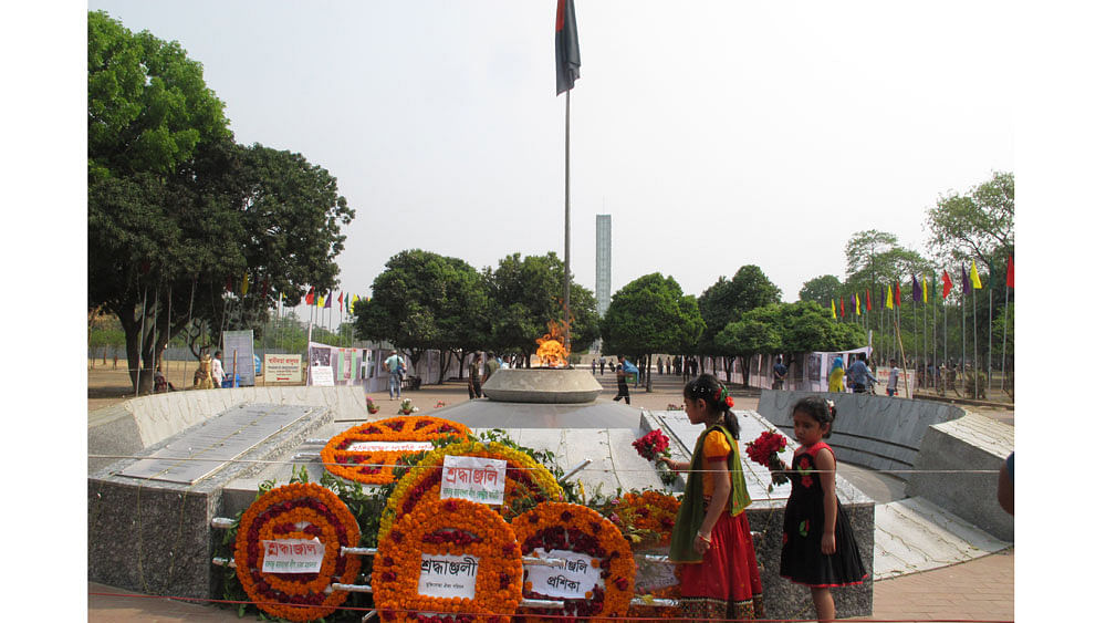 Today is the Independence Day of Bangladesh. Two children place floral wreath at the Shikha Chironton in the Shuhrawardy Udyan of the capital.