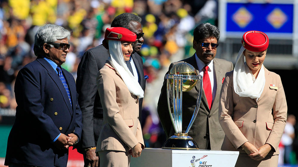 Former World Cup winning captains Kapil Dev of India , Arjuna Ranatunga of Sri Lanka  and Clive Lloyd of the West Indies stand with the trophy during the 2015 ICC Cricket World Cup final match. Photo: Shamsul Haque , Melbourne.