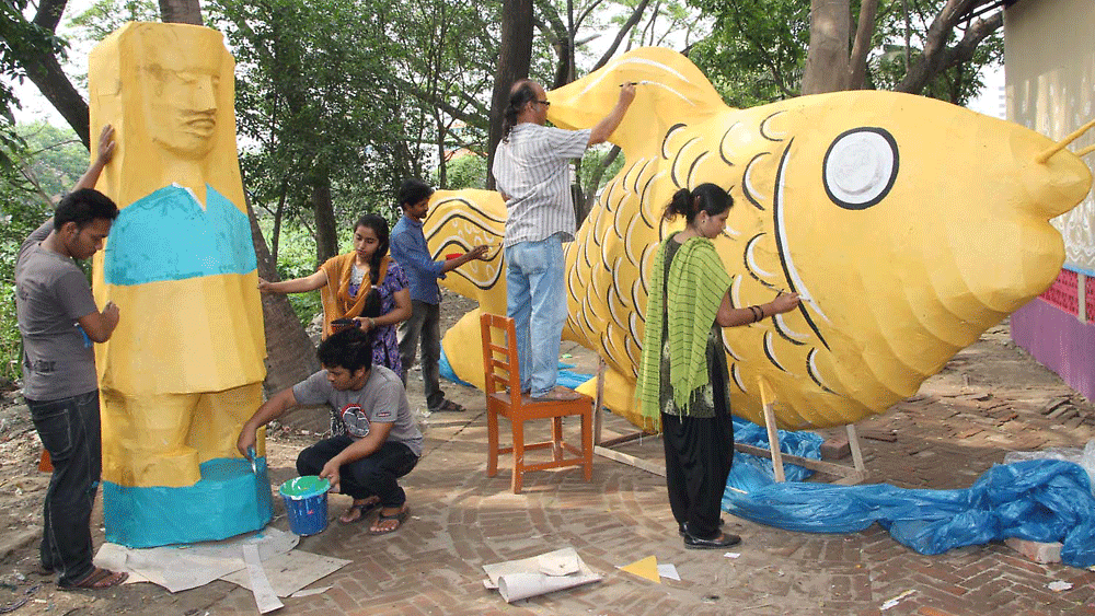 Artists are painting the fish and other dummy at the last minute for the rally to mark the Bengali New Year 1422 at Narayanganj Charukala Institute in Bhasha Sainik Mamtaz Begum road in the city on Monday. Photo: Pappu Bhattacharya