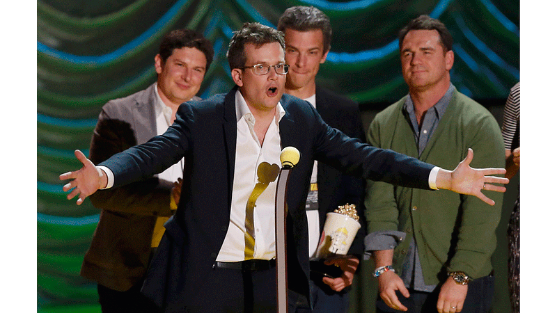 Writer John Green accepts the award for Movie of the Year for "The Fault In Our Stars" as the cast and crew look on at the 2015 MTV Movie Awards in Los Angeles, California April 12, 2015. Photo: Reuters