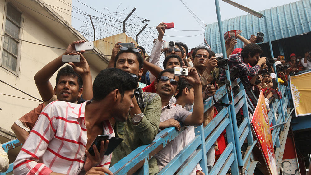 People taking pictures of Mongol Shova Jatra. Photo: Zahidul Karim