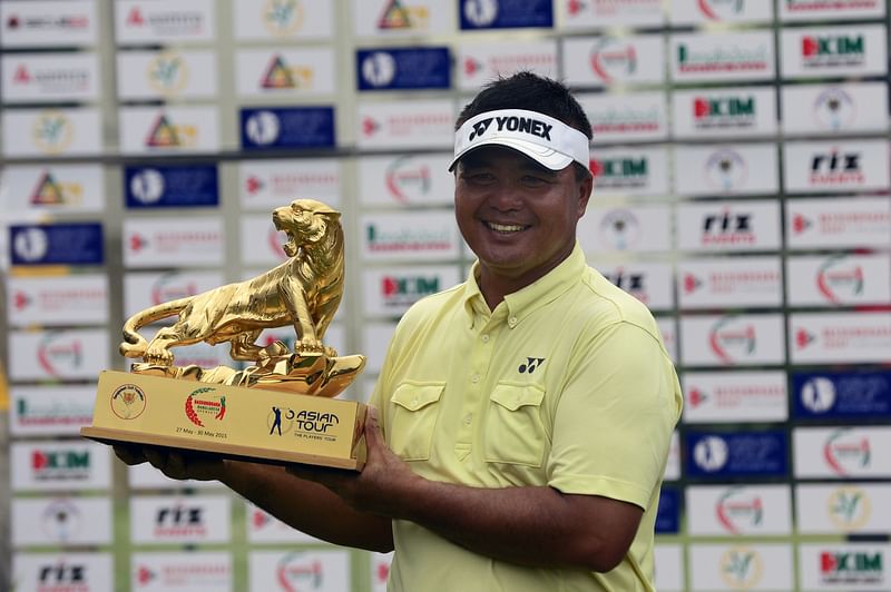 Mardan Mamat of Singapore poses with the trophy after winning the Bashundhara Bangladesh Golf Open at the Kurmitola Golf Club in Dhaka on May 30, 2015. AFP