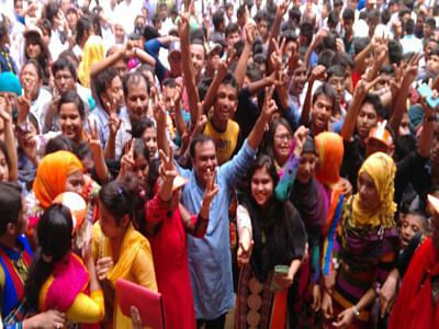 Students of Shamsul Haque Khan School and College in Dhaka's Demra area expresses their joy after obtaining the first position in Dhaka board in the SSC. Photo: Hasan Raja