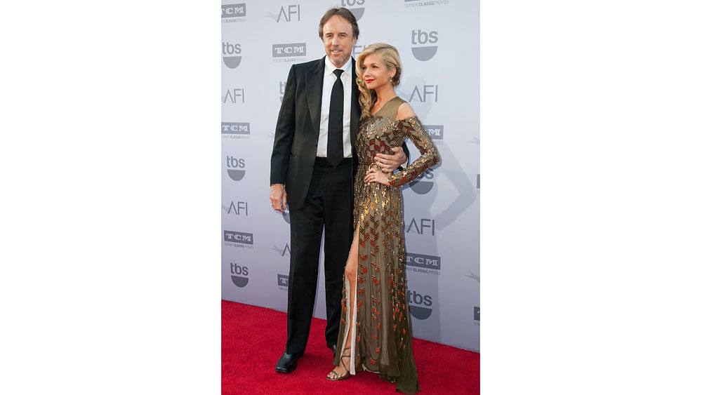 Actor-comedian Kevin Nealon (L) and actress Susan Yeagley arrive for the AFI Life Achievement Award Gala Honoring Steve Martin in Hollywood, California, June 4, 2015. Photo: AFP