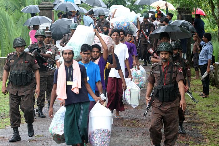 Migrants who were found adrift at sea in a boat are repatriated across the Bangladesh-Myanmar border at Ukhia on the outskirts of Cox's Bazar on June 8, 2015. 