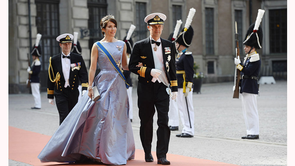 Crown Princess Mary of Denmark (L) and Crown Prince Frederik of Denmark arrive for the wedding of Sweden