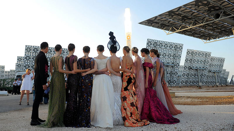 Models pose during the Jessica Minh Anh’s Summer Fashion Show 2015 at Gemasolar, a solar power plant in Fuentes de Andalucia, in the province of Sevilla on July 17, 2015. Photo: AFP