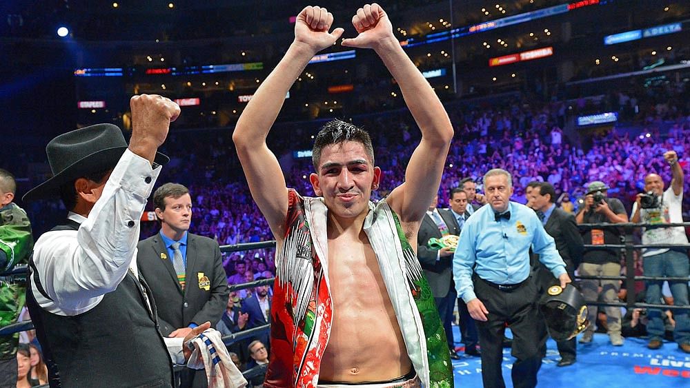 Leo Santa Cruz in the ring after he defeated Abner Mares (not pictured) in their WBC Diamond and WBA Featherweight Championship. Photo: Reuters