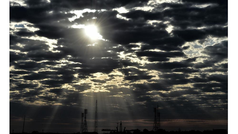 The sun shines through the clouds over a launch pad at the Russian-leased Baikonur cosmodrome in Kazakhstan early on August 31, 2015. Photo: AFP