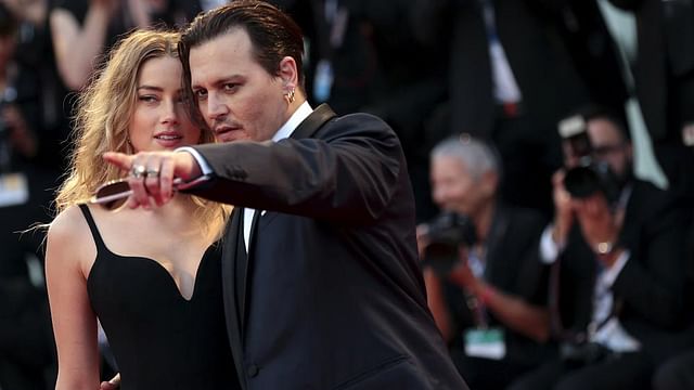 Actor Johnny Depp and his wife Amber Heard attend the red carpet event for the movie "Black Mass" at the 72nd Venice Film Festival in northern Italy 4 September, 2015.