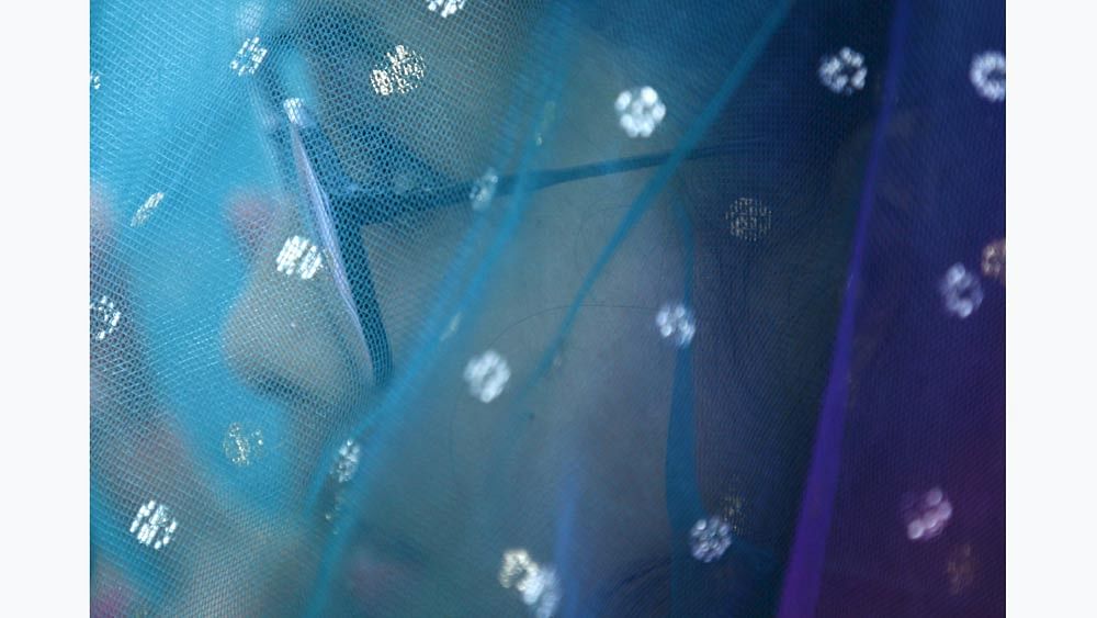 A girl covers herself with a shawl as she performs rituals during the Rishi Panchami festival, in Kathmandu, Nepal September 18, 2015. Photo: Reuters