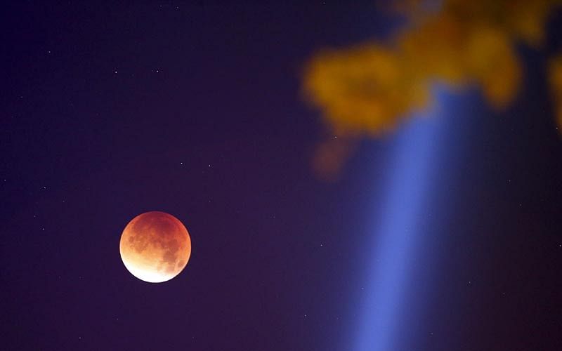 The Moon, appearing in a dim red colour, is covered by the Earth`s shadow during a total lunar eclipse over Paris, France September 28, 2015. Photo: Reuters