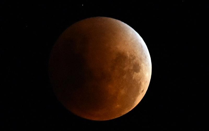 A view of the moon during a full eclipse in Asuncion on September 27, 2015. Photo: AFP