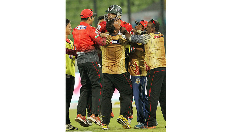 Skipper Mashrafe embraced by his teammates after winning the match. Photo: Shamsul Haque