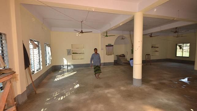 A devotee is washing out Shia Mosque in in Shibganj upazila of Bogra where caretaker of the mosque was killed in miscreants’ shooting. Photo: Soyel Rana