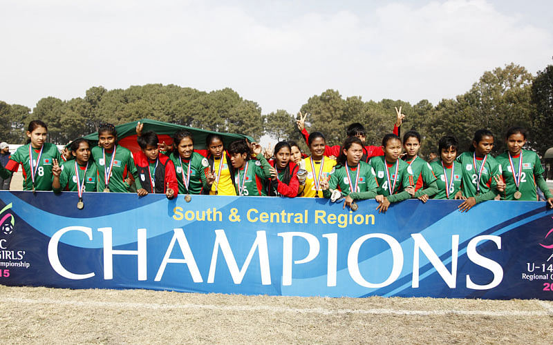 7.	Bangladeshi U-14 girls football players celebrates after winning the AFC regional championship against Nepal during the AFC regional championship match in Kathmandu on December 20, 2015. Bangladesh won 1-0. AFP