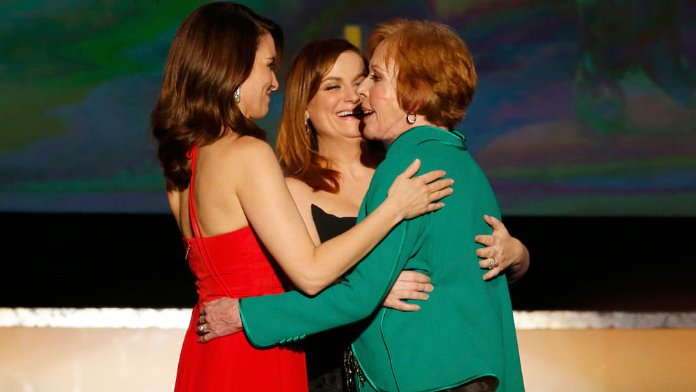 Carol Burnett hugs presenters Tina Fey (L) and Amy Poehler (C) after she accepted the Life Achievement Award at the 22nd Screen Actors Guild Awards in Los Angeles, California January 30, 2016.Photo: Reuters