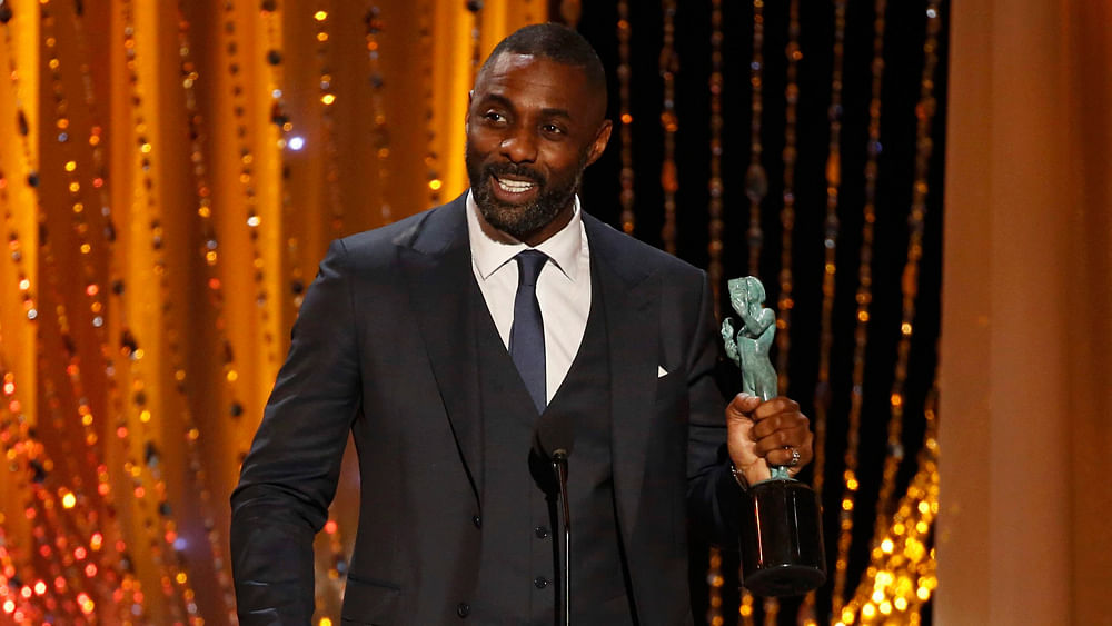 Idris Elba accepts the award for Outstanding Performance by a Male Actor in a Supporting Role for his role in `Beasts of No Nation` at the 22nd Screen Actors Guild Awards in Los Angeles, California January 30, 2016. Photo: Reuters