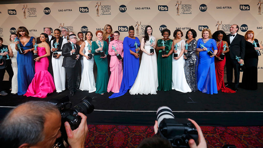 The cast of `Orange is the New Black` holds their awards for Outstanding Performance by an Ensemble in a Comedy Series during the 22nd Screen Actors Guild Awards in Los Angeles, California January 30, 2016. Photo: Reuters