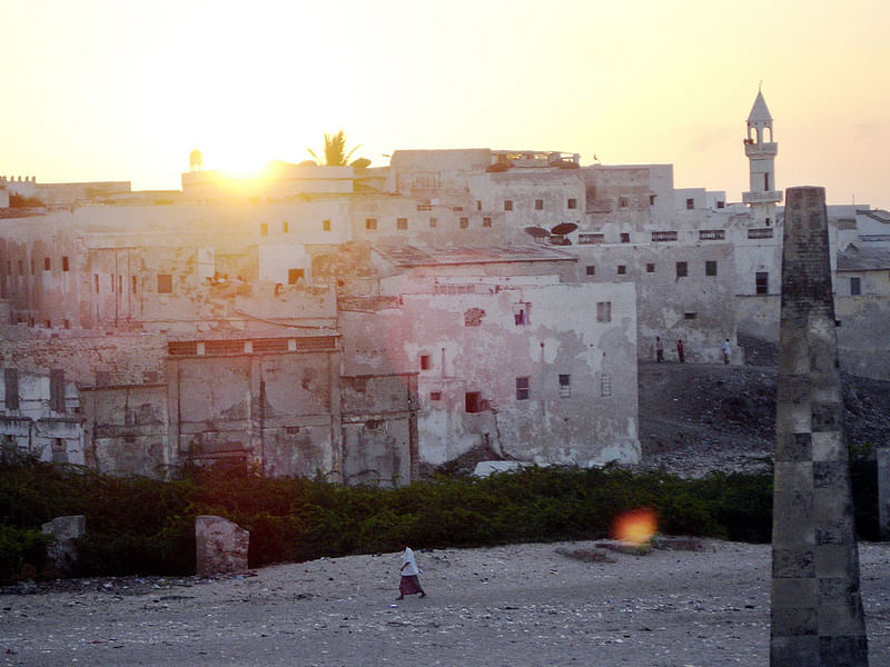 This file photo shows a man walking past the old buildings of the Southern Somalia’s port town of Merka. Somali government troops and African Union peacekeepers recaptured the key port of Merka from Shebab insurgents on Saturday. Photo: AFP Somali, AU troops retake key port from Shebab