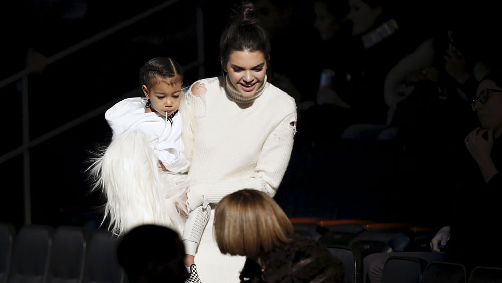 Kendall Jenner arrives holding North West, for Kanye West`s Yeezy Season 3 Collection presentation and listening party for the `The Life of Pablo` album during New York Fashion Week February 11, 2016. Photo: Reuters