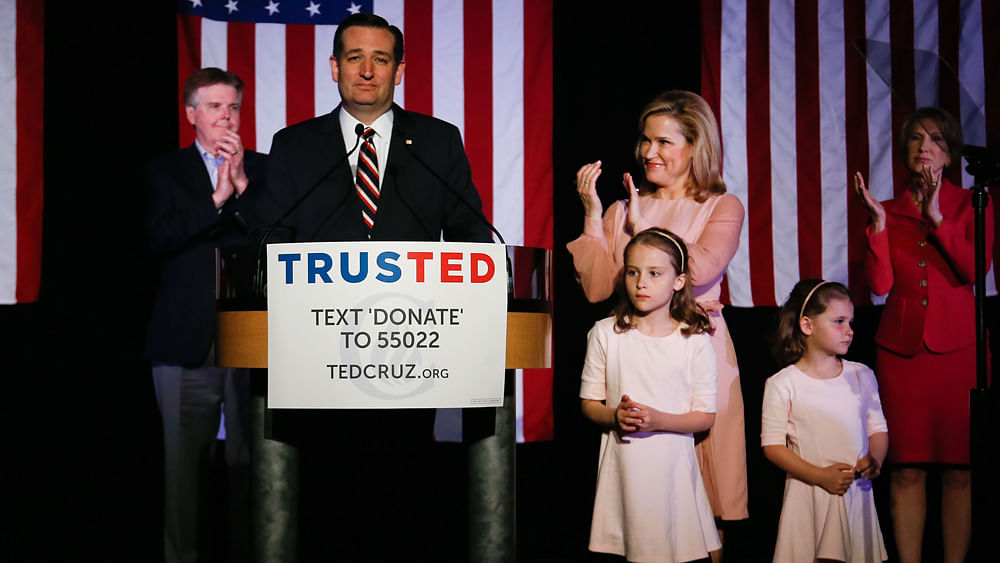 Republican presidential candidate Sen. Ted Cruz (R-TX) speaks at a watch party as his wife, Heidi Cruz, and daughters Catherine Cruz and Caroline Cruz and colleagues Carly Fiorina (R) and Lt. Gov. Dan Patrick (L) look on 15 March 2016 in Houston, Texas. Photo: AFP