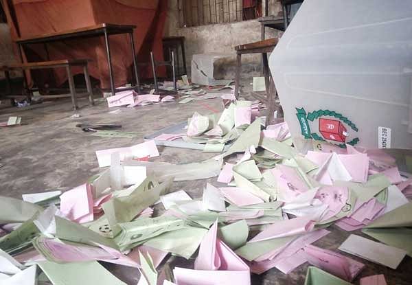 Thrown away ballot papers on the ground after miscreants attacked the Shatbila primary school centre in Brahmanbaria’s Bancharampur as violence marked the first phase of the upazila elections. Photo: Focus Bangla