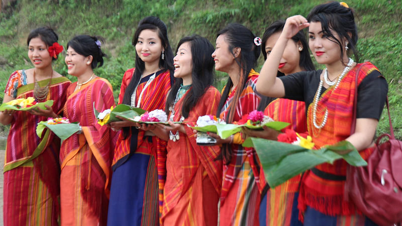 Revellers celebrate ‘Baisabi’ festival, marking the inauguration of Chakma ‘Phool Bijhu’, Tripura ‘Boisu’ and the Marma community’s ‘Sangrai’ festivals, that begins on Tuesday in the Chittagong Hill Tracts with much enthusiasm. Photo: Prothom Alo