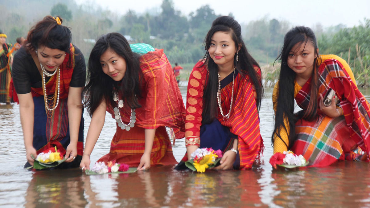 Revellers celebrate ‘Baisabi’ festival, marking the inauguration of Chakma ‘Phool Bijhu’, Tripura ‘Boisu’ and the Marma community’s ‘Sangrai’ festivals, that begins on Tuesday in the Chittagong Hill Tracts. Photo: Prothom Alo