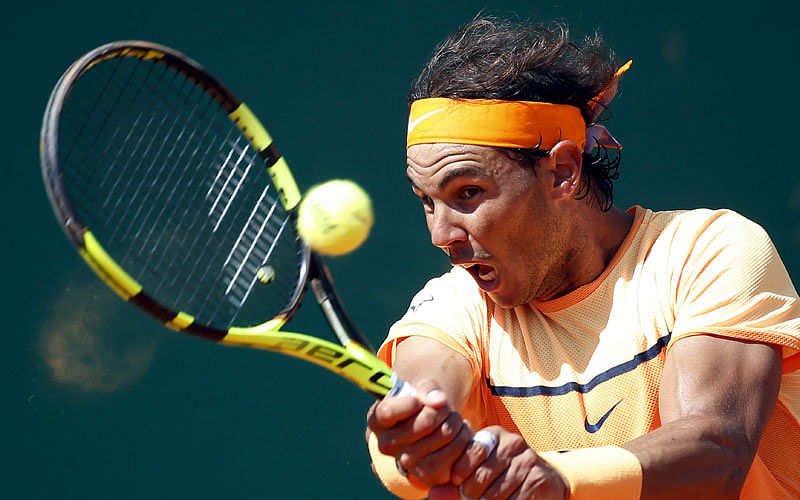 Rafael Nadal of Spain plays a shot to Andy Murray of Britain. Photo: Reuters