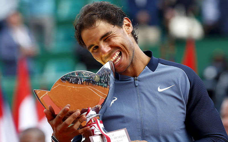 Rafael Nadal of Spain poses with his trophy after winning his final tennis match against Gael Monfils of France at the Monte Carlo Masters. Photo: Reuters