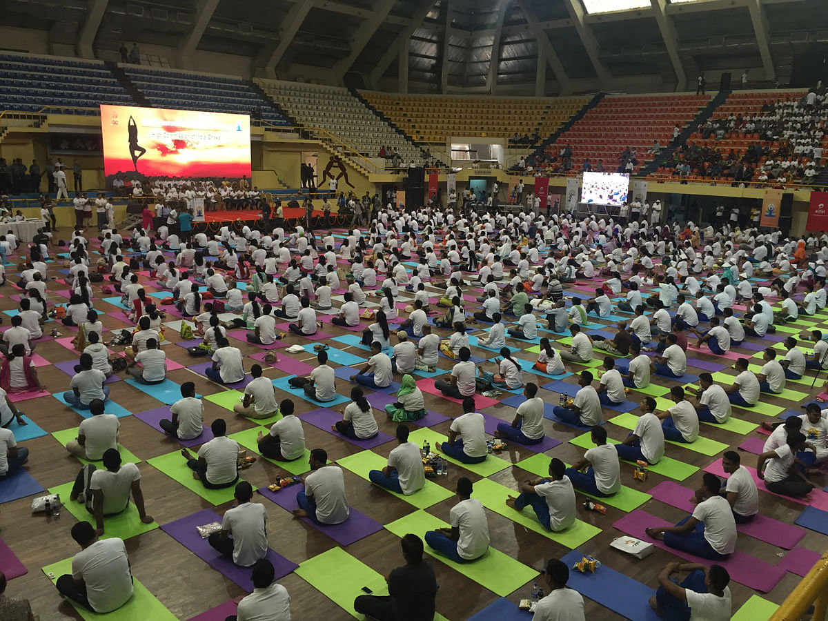 Participants observe World Yoga Day at Mirpur Indoor Stadium in the capital on Tuesday. Photo : Tazrian Rahman