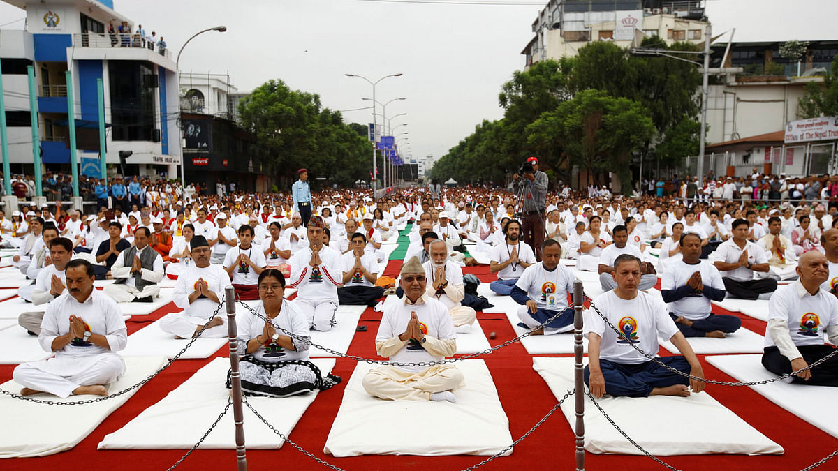 Nepal’s Prime Minister Khadga Prasad Sharma Oli, also known as KP Oli, © takes part during World Yoga Day in Kathmandu, Nepal. Photo: Reuters