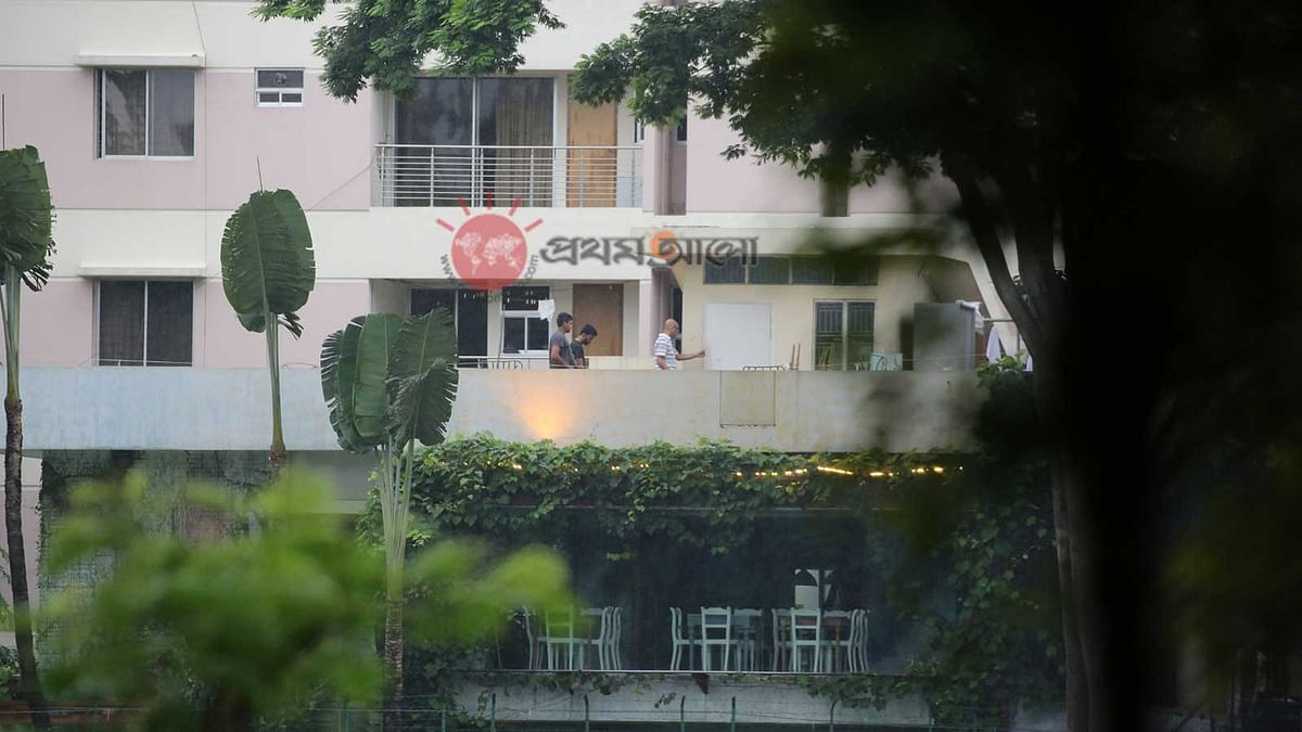 A foreigner, followed by apparently two hostage-takers, walks on the roof of Holey Artisan Bakery at Gulshan in Dhaka around 6:30am, an hour before the rescue operation by joint force. Prothom Alo photo