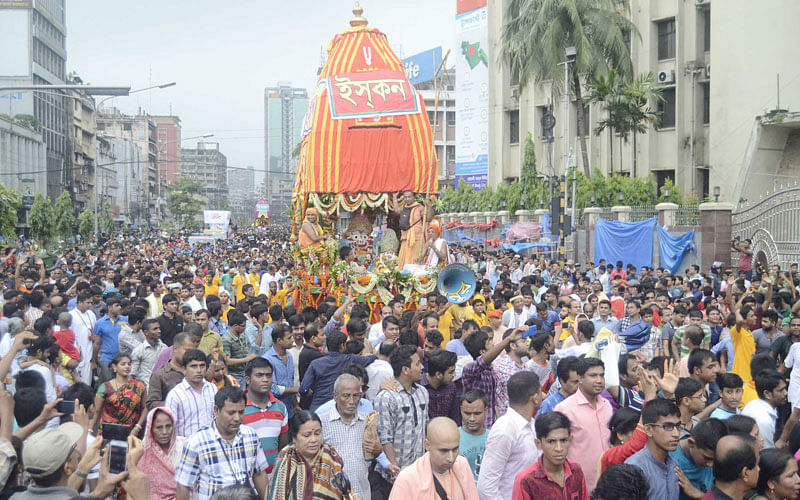 Devotees pull the rope of Ratha on the capital on Wednesday. Photo: Focus Bangla