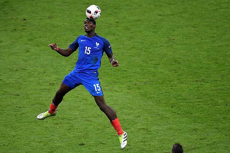 France`s midfielder Paul Pogba heads the ball during the Euro 2016 final football match between Portugal and France at the Stade de France in Saint-Denis, north of Paris, on July 10, 2016. Photo: AFP